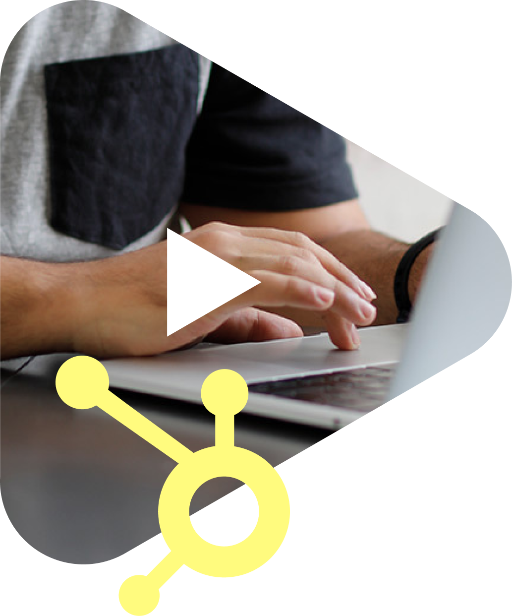 Image of a person typing on a laptop with a HubSpot logo